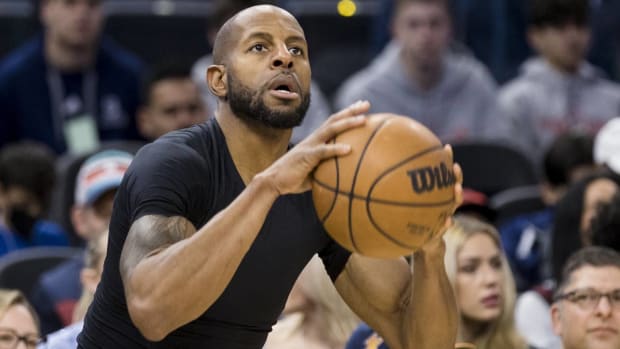 Warriors forward Andre Iguodala shoots a ball in warmups before a game.